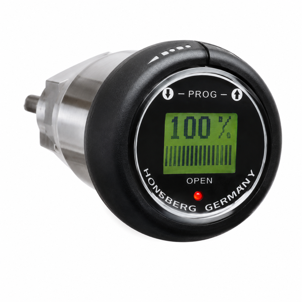 Flow transmitter with LCD display showing 100% reading and status indicator in a compact stainless steel housing.